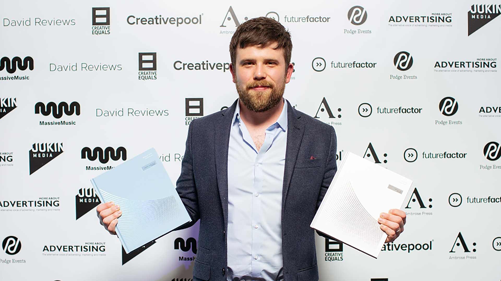 Photo of me with my two awards